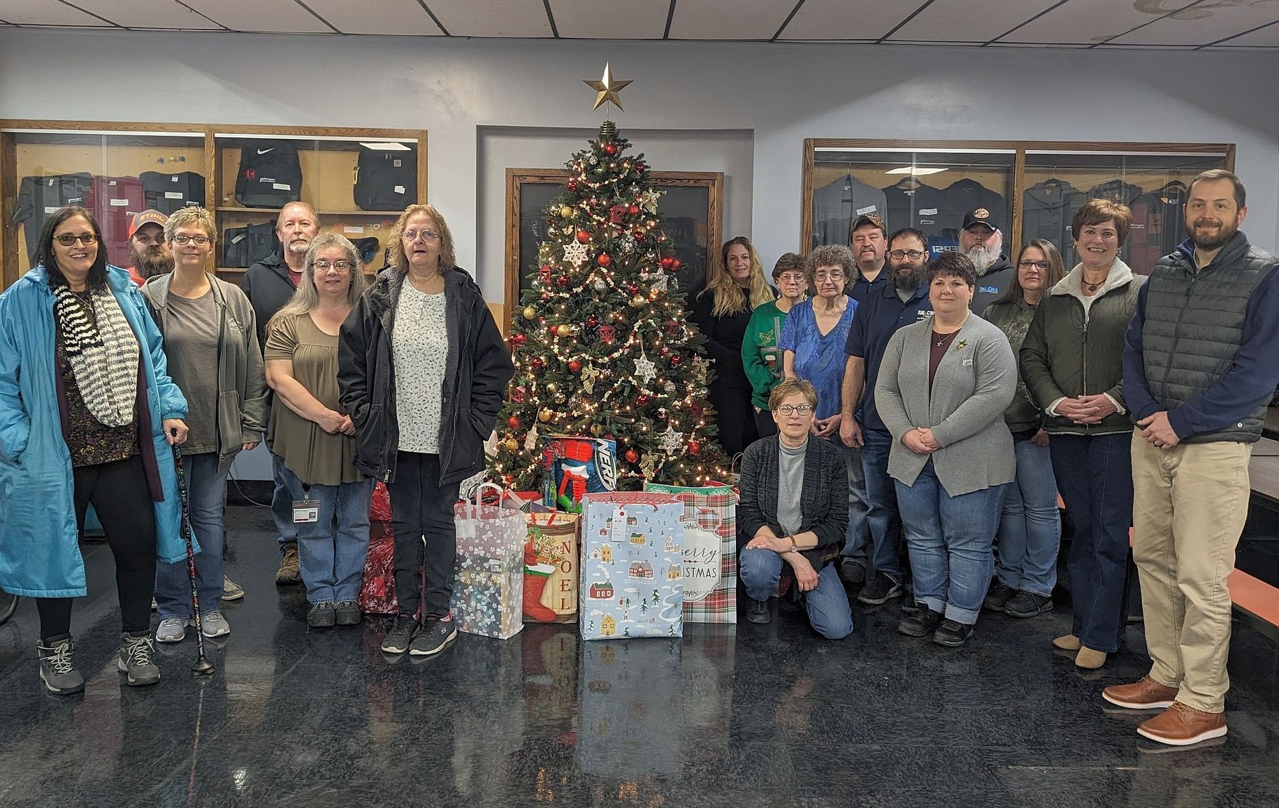 Morgan and DCI employees pose with gifts in Coudersport